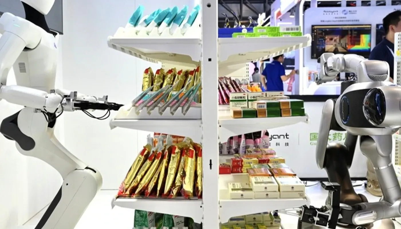 Three heterogeneous robots at Ant Group's smart pharmacy booth completing an order in under 90 seconds at WAIC 2026